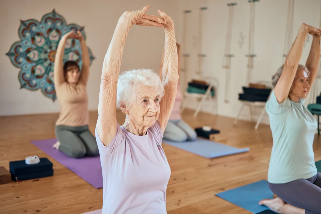 elderly woman yoga and stretching in class for he 2023 01 04 19 53 44 utc